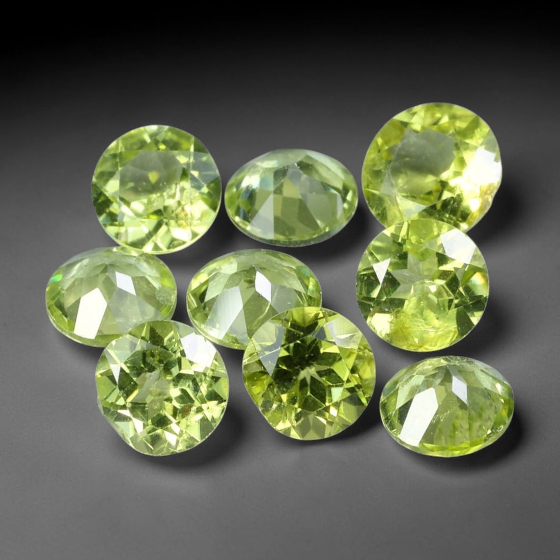 4.45ct Natural Olive Green Peridot Round Cut Loose Gemstone 9pcs Parcel, 9TT: This parcel contains nine round faceted natural peridots with total aggregate weight of 4.45 carats, each stone measuring 5.5x2.7mm. The gemstones show bright olive-green colouration with fine natural