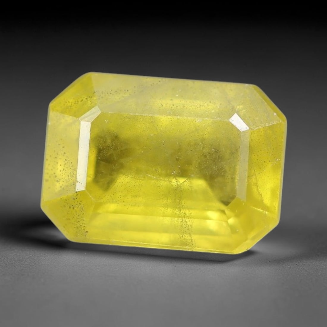 1.41 Carats Natural Yellow Sapphire Octagon Faceted Loose Gemstone, 47TT: This natural yellow sapphire features a classic octagon brilliant faceted cut, holding consistent warm golden-yellow color throughout the corundum crystal. Fine microscopic mineral specks and faint na