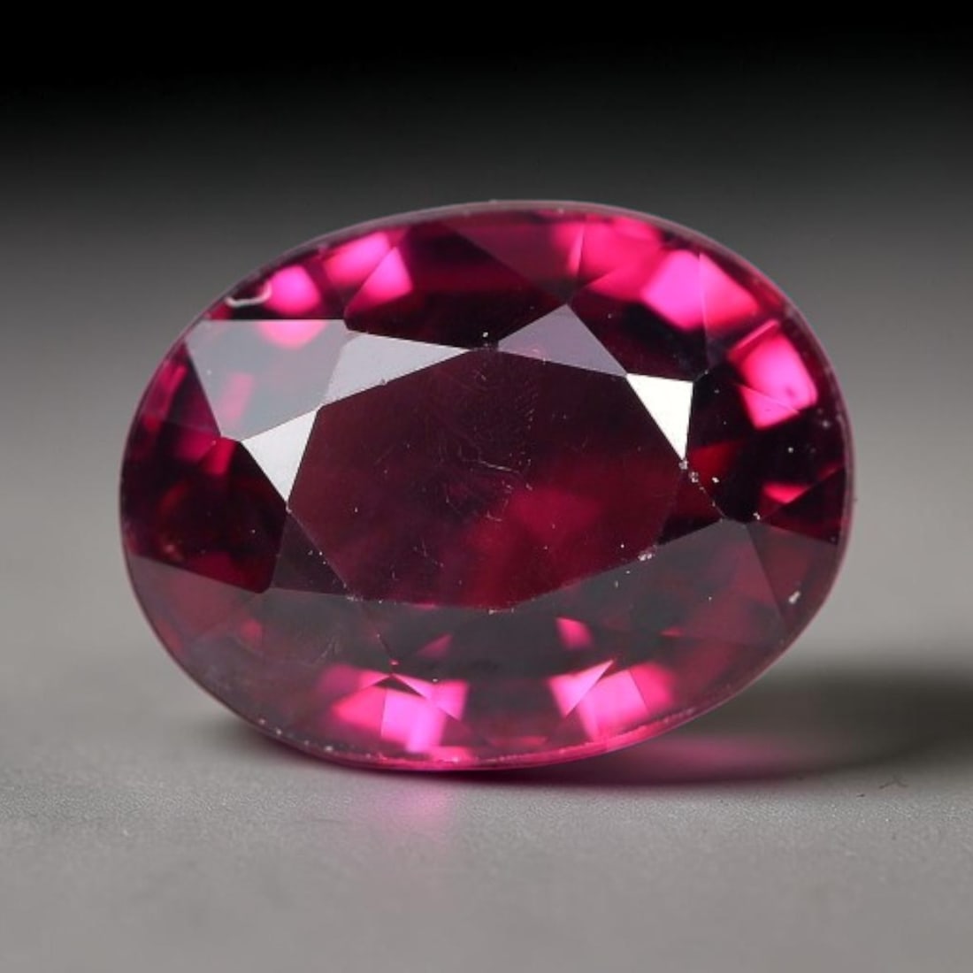 1.76 Carats Natural Deep Burgundy Red Garnet Oval Faceted Loose Gemstone, 72TS: This timeless faceted garnet boasts a luxuriously deep burgundy red tone that glows with vivid crimson fire across its precisely polished reflective facets. Fine natural micro mineral specks are scatt