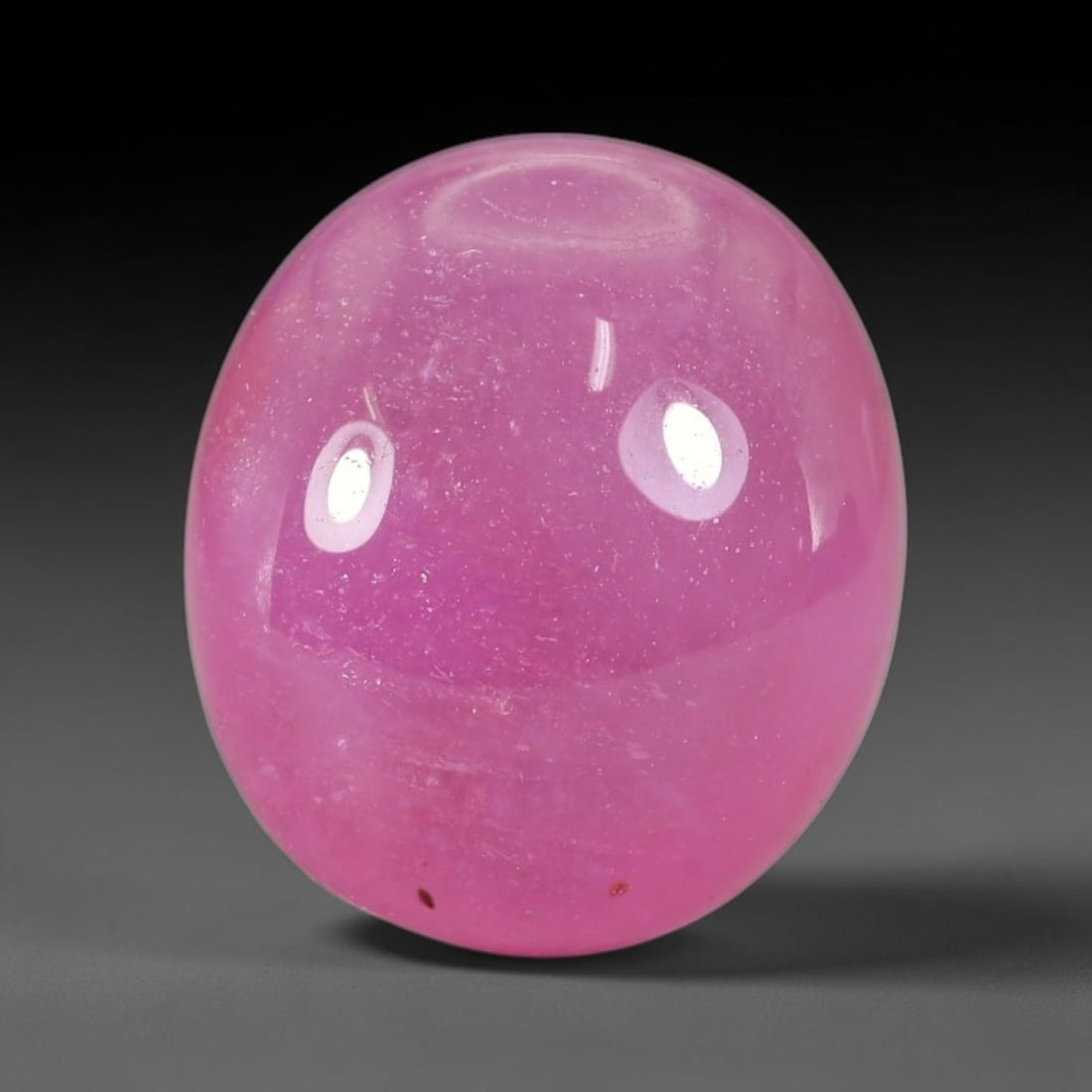 12.33 Carats Natural Mozambique Ruby Cabochon Loose Gemstone, 53TM: This ruby originates from Mozambique natural mineral deposits and receives professional cabochon grinding and polishing treatment to form a smooth glossy exterior surface. Tiny mineral particles and n