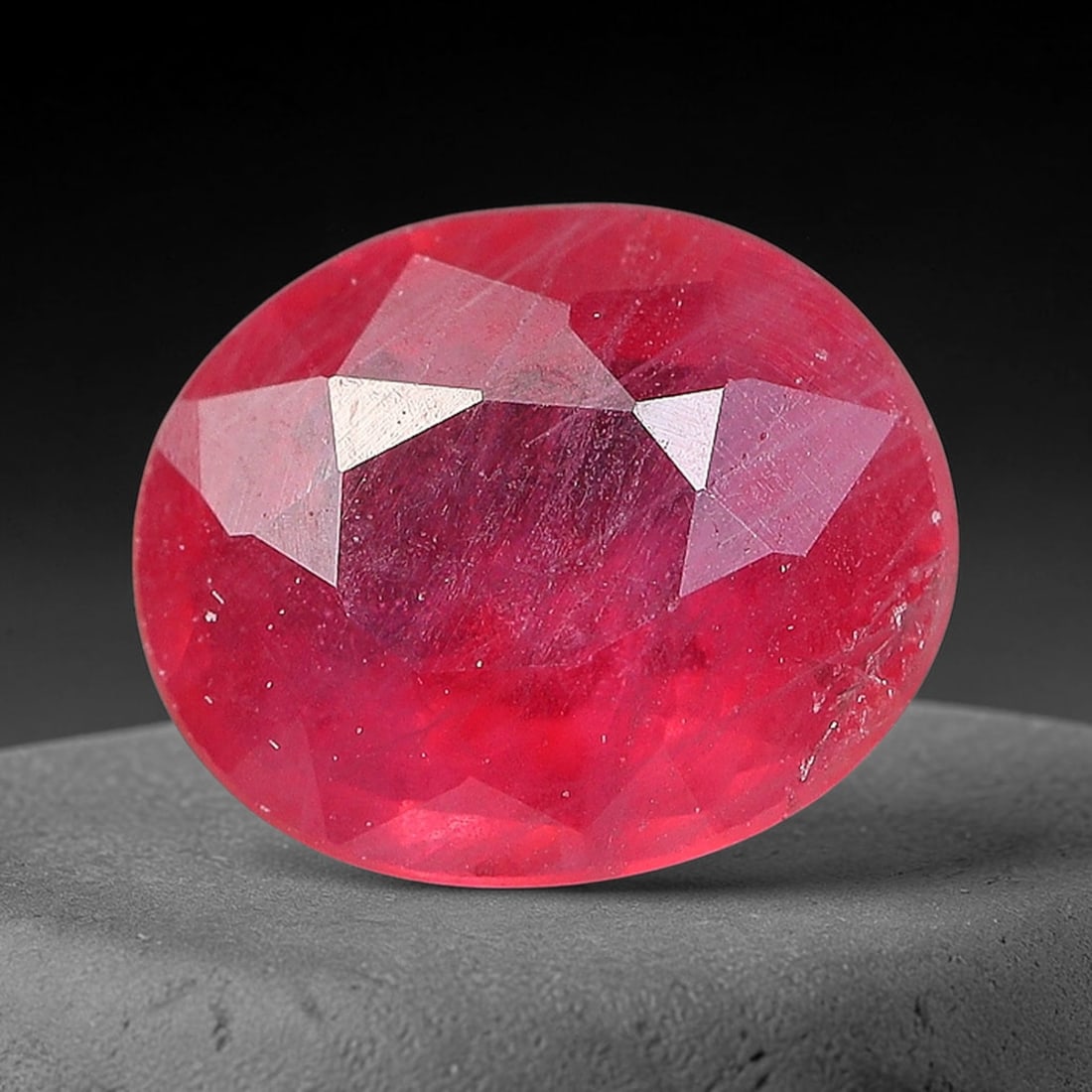 0.67 Carats Natural Orange Sapphire Oval Faceted Loose Gemstone, 71YW: This natural orange sapphire is fashioned in a classic oval brilliant faceted cut, presenting soft warm orange hues consistent with natural corundum specimens. Fine scattered mineral specks and faint 