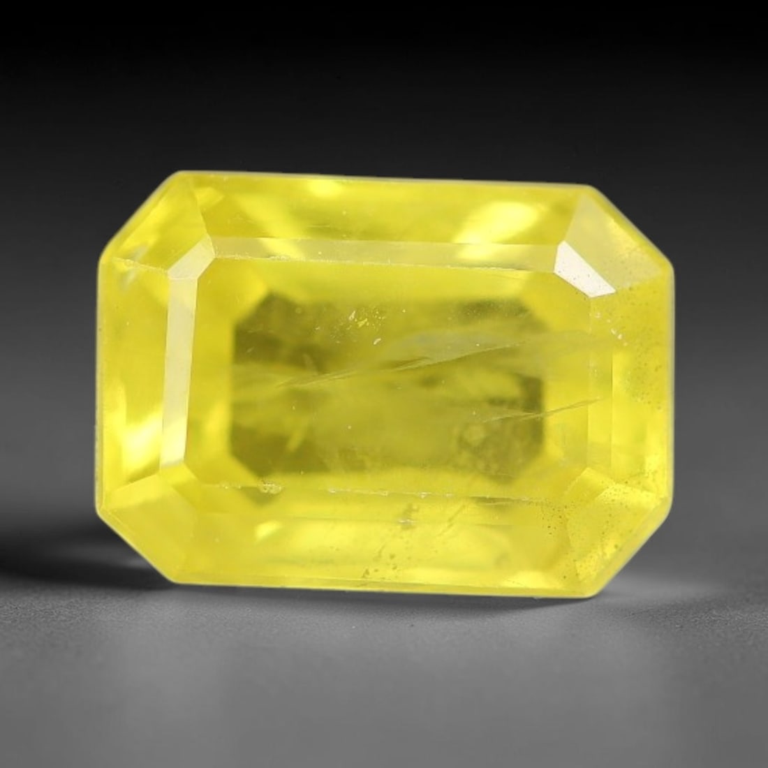 1.42 Carats Natural Yellow Sapphire Octagon Faceted Loose Gemstone, 52TT: This natural yellow sapphire features a classic octagon brilliant faceted cut, holding consistent warm golden-yellow color throughout the corundum crystal. Fine microscopic mineral specks and faint na
