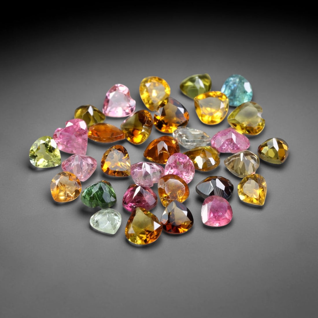 4.76ct Natural Multi Color Tourmaline Heart Cut Loose Gemstone 32pcs Parcel, 26TZ: This parcel contains 32pcs heart faceted natural tourmalines with total aggregate weight of 4.76 carats, each stone measuring 4.0x3.8x2.1mm. The gemstones display a varied palette of pink, green, yell