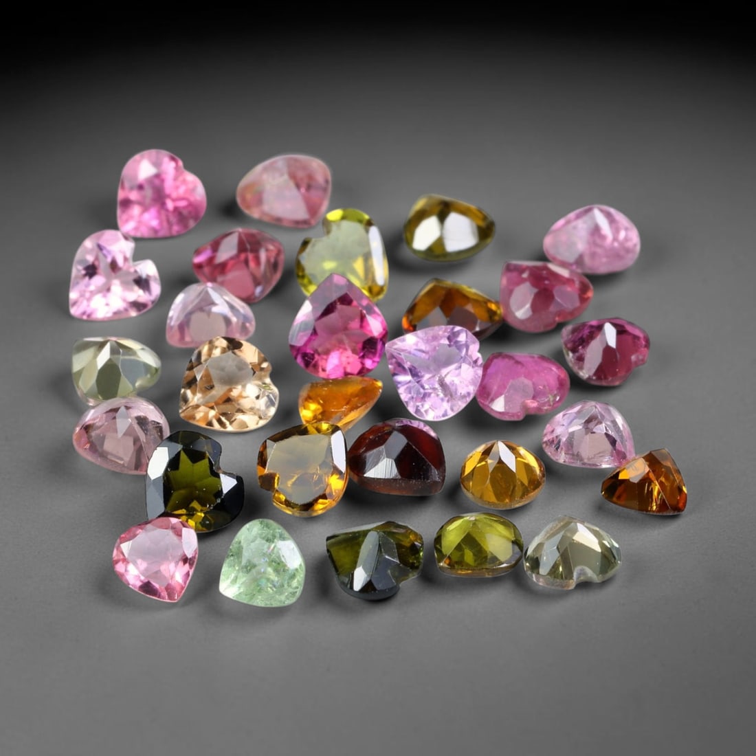 4.45ct Natural Multi Color Tourmaline Heart Cut Loose Gemstone 29pcs Parcel, 29TZ: This parcel contains 29pcs heart faceted natural tourmalines with total aggregate weight of 4.45 carats, each stone measuring 3.8x3.7x1.8mm. The gemstones display a varied palette of pink, green, yell