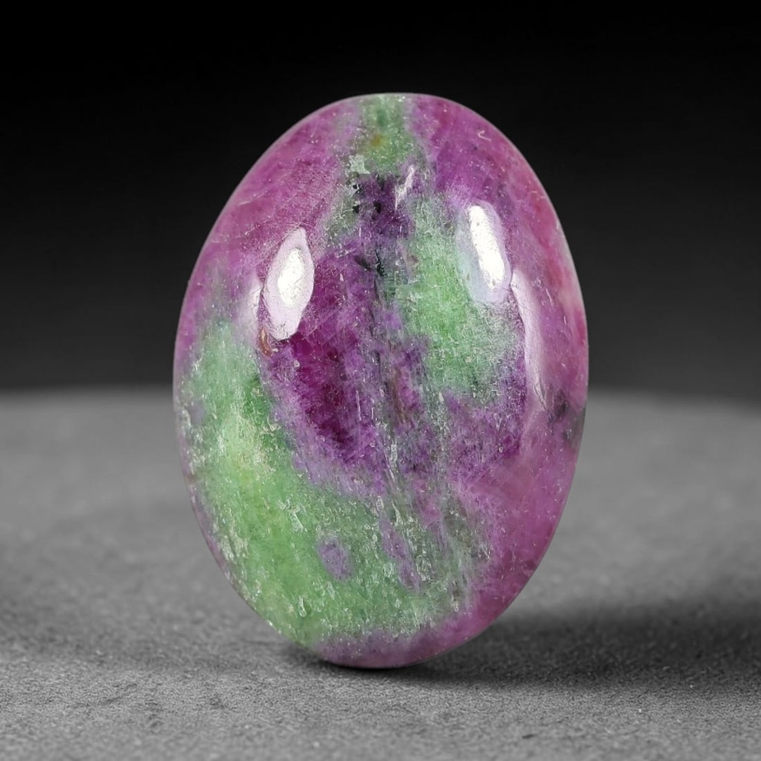 11.47ct Natural Ruby Zoisite Cabochon Loose Gemstone, 27TY: Natural ruby zoisite cabochon cut, dimensions 19.0x13.7x4.7mm. Rich magenta and deep purple swirling colour pattern with natural mineral veining across the polished surface. Smooth polished cabochon f