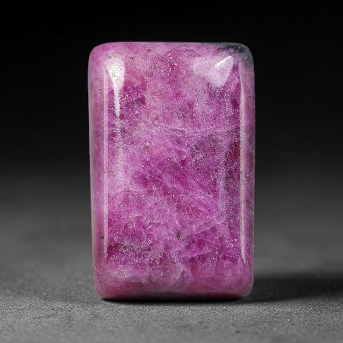 15.60ct Natural Ruby Zoisite Cabochon Loose Gemstone, 89TZ: Natural ruby zoisite cabochon cut, dimensions 17.7x11.3x5.0mm. Rich magenta and deep purple swirling colour pattern with natural mineral veining across the polished surface. Smooth polished cabochon f