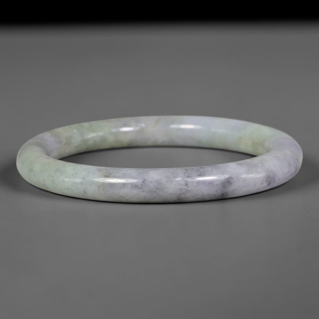 Natural Burmese Type A Lavender Grey Speckled Jadeite Jade Slim Bangle Bracelet, 7TJ: Polished slim jadeite bangle with soft pale lavender base blended with muted celadon green and subtle grey speckled inclusions. Inner dimension 57.2x8.7mm, thin rounded band with smooth natural luster