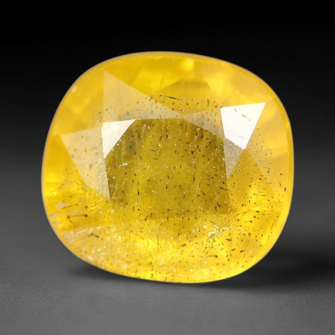 2.15 Carats Natural Yellow Sapphire Oval Faceted Loose Gemstone, 63TT: This natural yellow sapphire features a classic oval brilliant faceted cut, holding consistent warm golden-yellow color throughout the corundum crystal. Fine microscopic mineral specks and faint natur