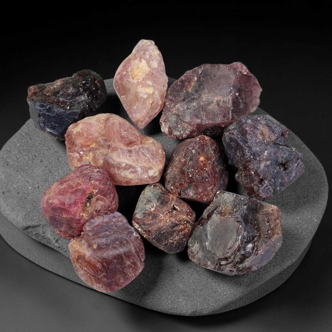 193.66ct Natural Spinel Rough Gemstone Parcel, Raw Spinel Crystals, 50TV: Natural spinel rough parcel with largest specimen measuring 22.7x14.6x8.7mm. Raw unpolished spinel crystals showing varied tones of red, pink, purple and grey, featuring natural crystalline textures, 