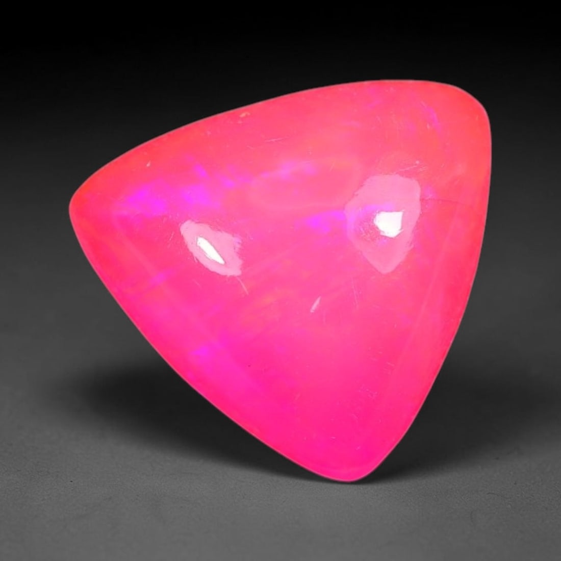 2.23ct Natural Ethiopian Welo Pink Fire Opal Cabochon Loose Gemstone, 91TS: This opal is sourced from Ethiopian Welo natural opal deposits and shaped into a smooth polished cabochon form with refined lapidary finishing work. Bright warm pink base accompanied by vivid internal
