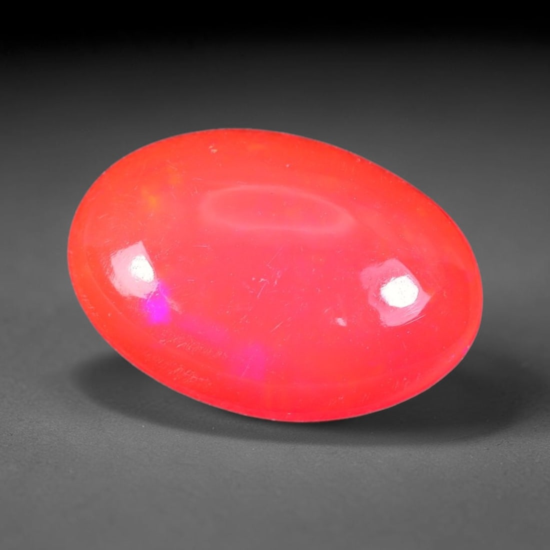 2.47ct Natural Ethiopian Welo Pink Fire Opal Cabochon Loose Gemstone, 84TS: This opal is sourced from Ethiopian Welo natural opal deposits and shaped into a smooth polished cabochon form with refined lapidary finishing work. Bright warm pink base accompanied by vivid internal