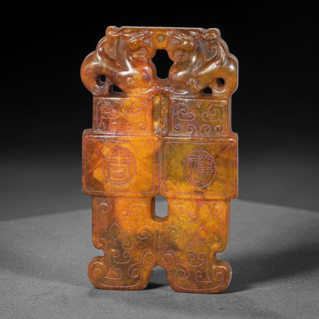 A Chinese Open-Work Carved Mottled Russet Jade Stone Double-Beast Auspicious Character Pendant, 94YF: Symmetrical open-work jade pendant with two carved mythical beast figures at the top. Fine incised scroll patterns and circular seal-style character motifs decorate the front surface. Multiple pierced