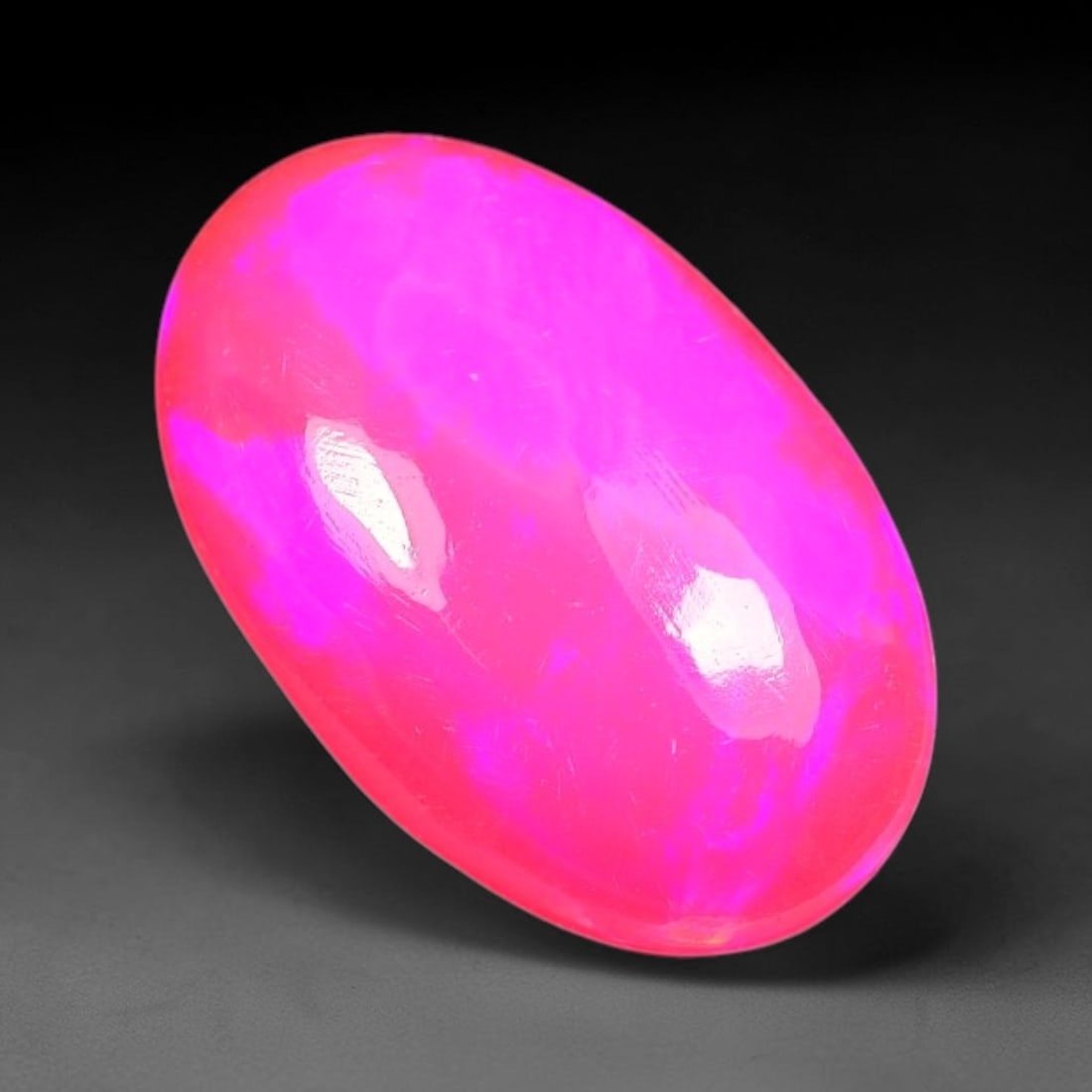 2.07ct Natural Ethiopian Welo Pink Fire Opal Cabochon Loose Gemstone, 90TS: This opal is sourced from Ethiopian Welo natural opal deposits and shaped into a smooth polished cabochon form with refined lapidary finishing work. Bright warm pink base accompanied by vivid internal