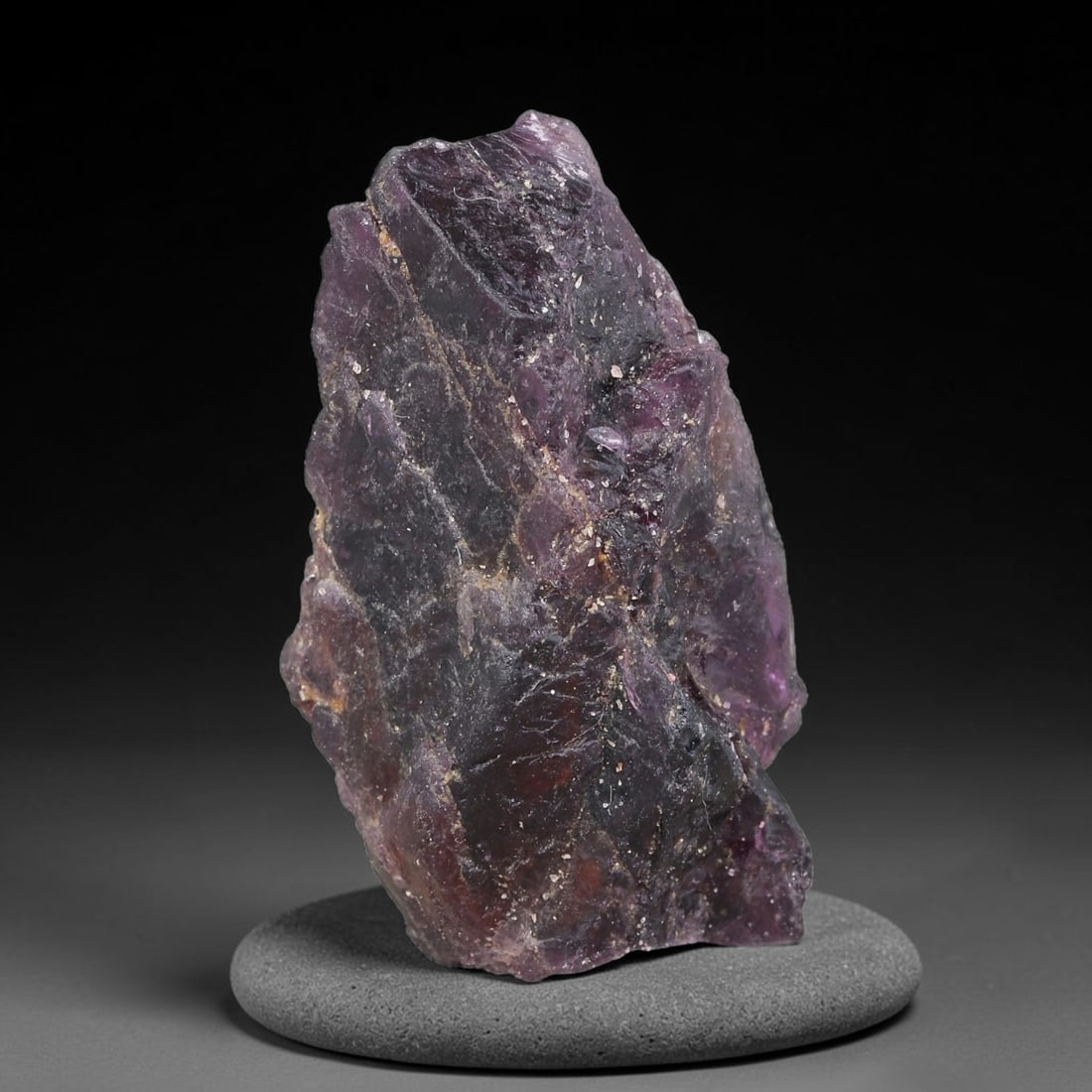 103.82ct Natural Purple Spinel Rough Gemstone, Raw Spinel Crystal, 23TV: Natural purple spinel rough specimen weighing 103.82 carats, measuring 36.6x21.5x15.0mm. Unpolished raw crystal showing deep purple tones with reddish undertones, natural fractures, mineral veining an
