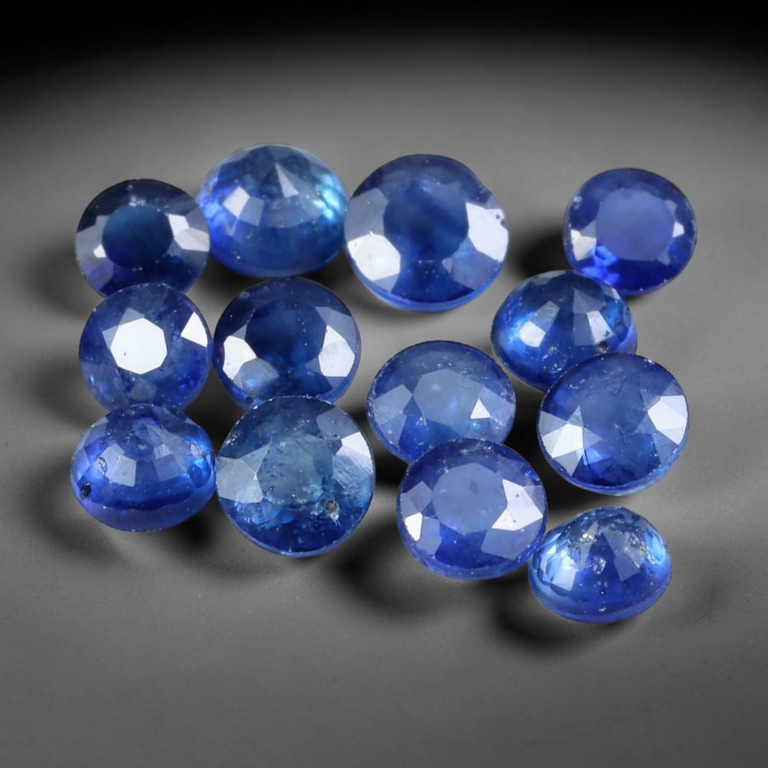 3.20ct Natural Blue Sapphire Round Cut Loose Gemstone Parcel, 14TZ: This parcel round faceted natural blue sapphires with each stone measuring 3.8x2.4mm. The gemstones show saturated deep blue colouration with natural mineral inclusions and subtle internal growth feat