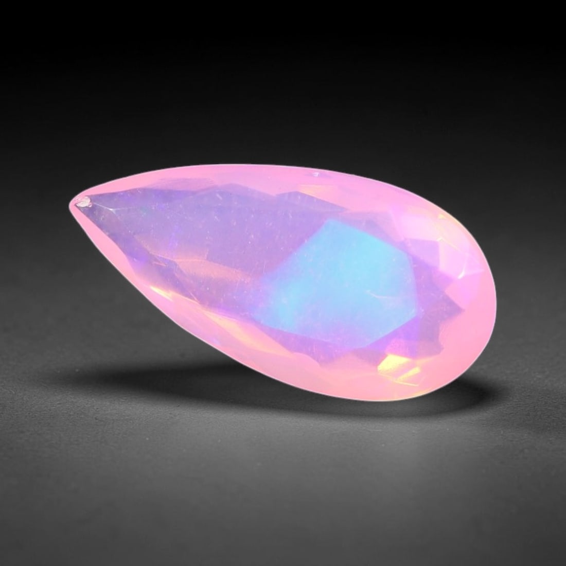 1.49 Carats Natural Ethiopian Welo Pink Fire Opal Pear Faceted Loose Gemstone, 93TS: This opal is sourced from the Welo mining region of Ethiopia and crafted into faceted form via professional lapidary cutting with smooth polished facets across the exterior surface. Subtle natural int