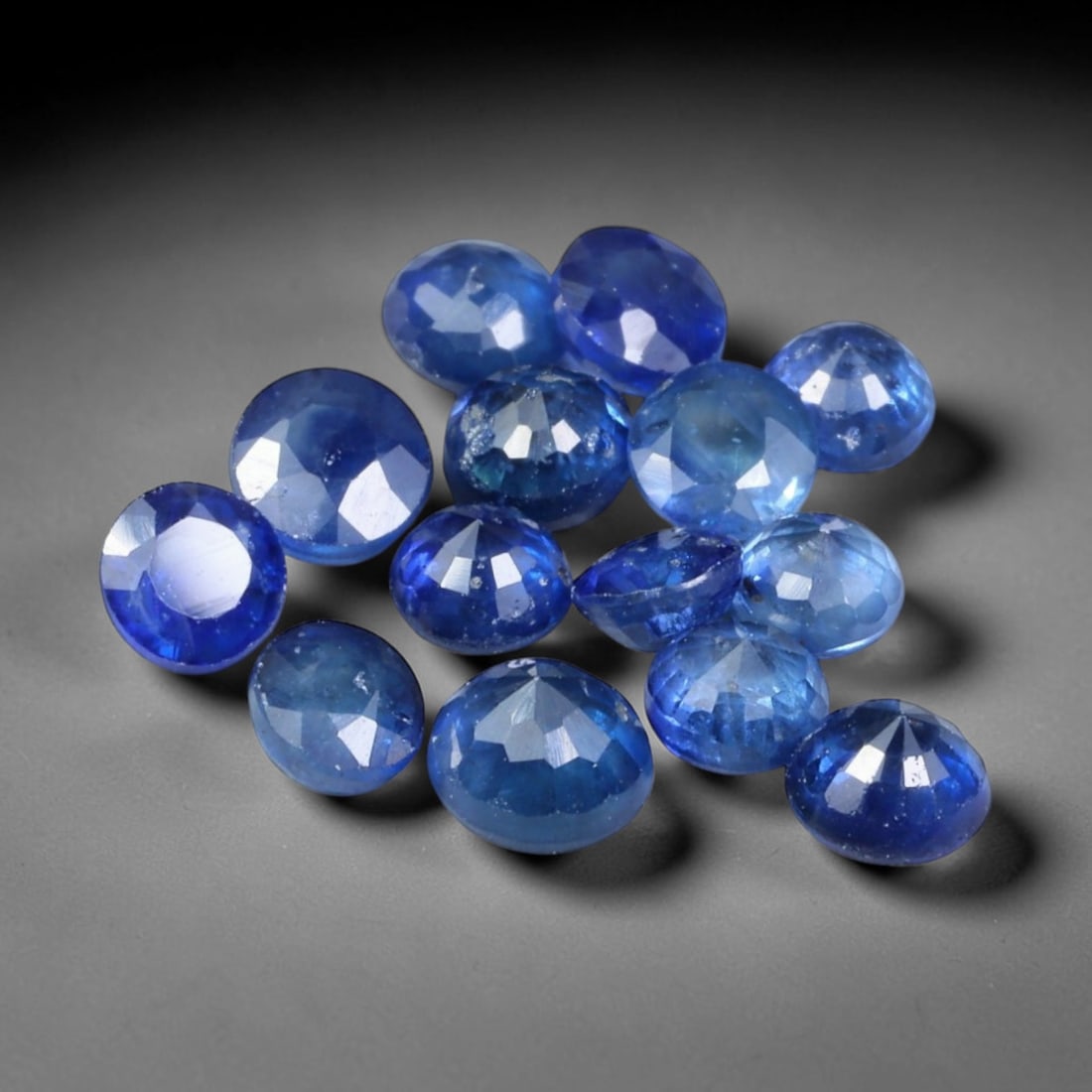 3.31ct Natural Blue Sapphire Round Cut Loose Gemstone Parcel, 11TZ: This parcel round faceted natural blue sapphires with each stone measuring 4.0x2.9mm. The gemstones show saturated deep blue colouration with natural mineral inclusions and subtle internal growth feat