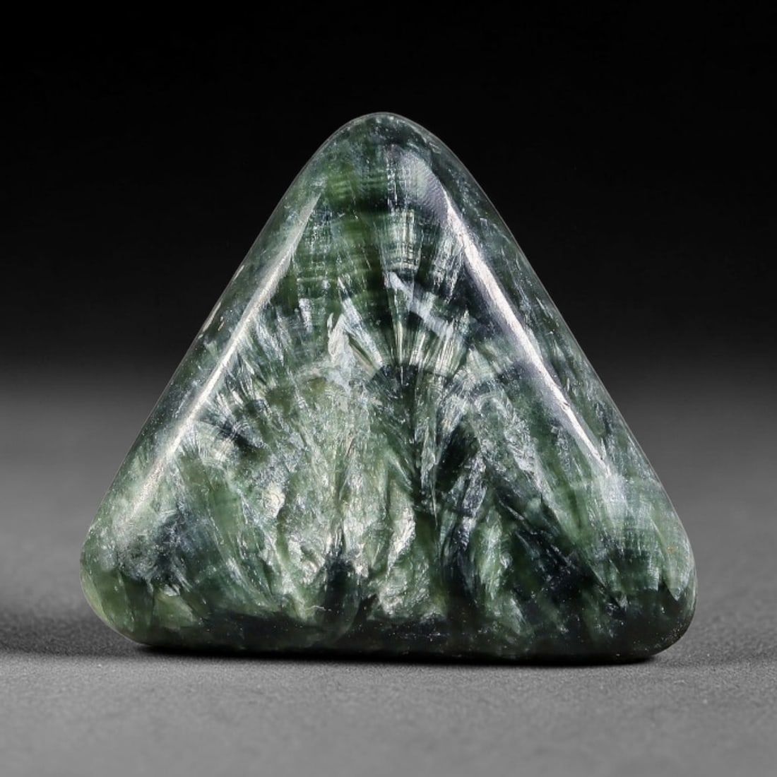12.13 Carats Natural Deep Green Siberian Seraphinite Polished Cabochon, 68TZ: This is a fully natural polished seraphinite specimen sourced from Siberian deposits, displaying distinct feathery fibrous inclusions that create beautiful flowing chatoyant patterns across its smooth