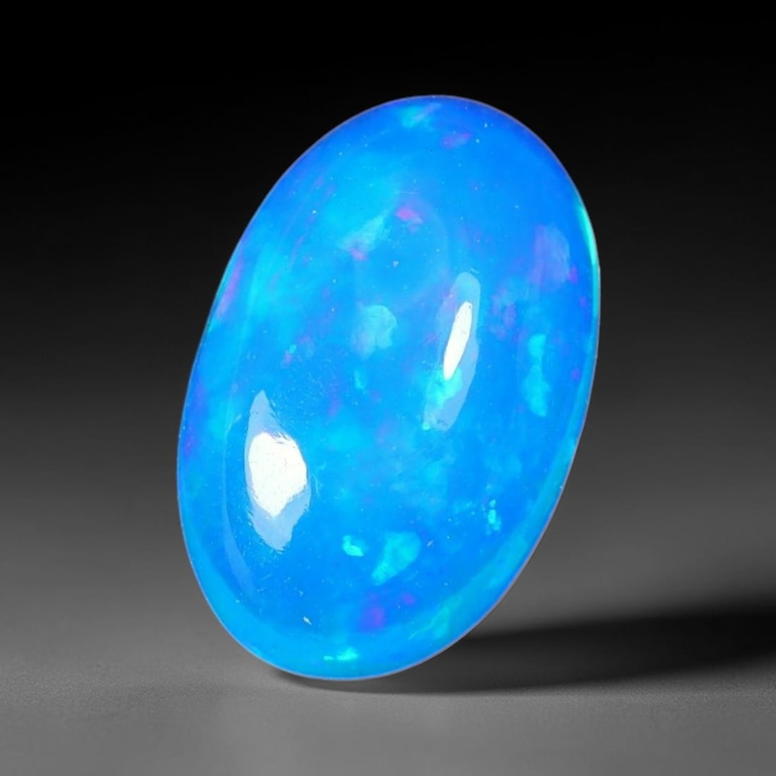 3.66ct Natural Ethiopian Welo Blue Fire Opal Cabochon Loose Gemstone, 92TH: This opal is sourced from Ethiopian Welo natural opal deposits and shaped into a smooth polished cabochon form with refined lapidary finishing work. Bright warm blue base accompanied by vivid internal