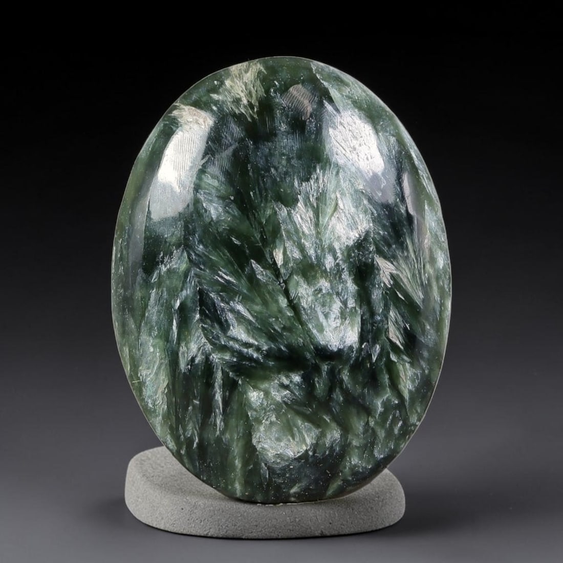 12.29 Carats Natural Deep Green Siberian Seraphinite Polished Cabochon, 48TZ: This is a fully natural polished seraphinite specimen sourced from Siberian deposits, displaying distinct feathery fibrous inclusions that create beautiful flowing chatoyant patterns across its smooth