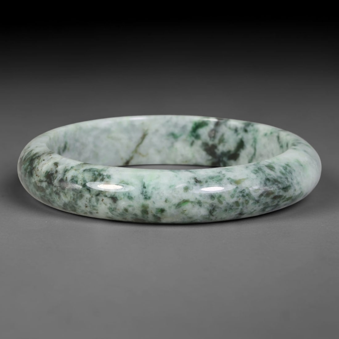 Natural Burmese Type A Variegated Floating Green Jadeite Jade Bangle Bracelet, 92TD: Beautifully polished jadeite bangle with pale milky white base swirled with dramatic variegated dark floating green mottling and veining. Inner dimension 60x13mm, smooth rounded band with natural glos