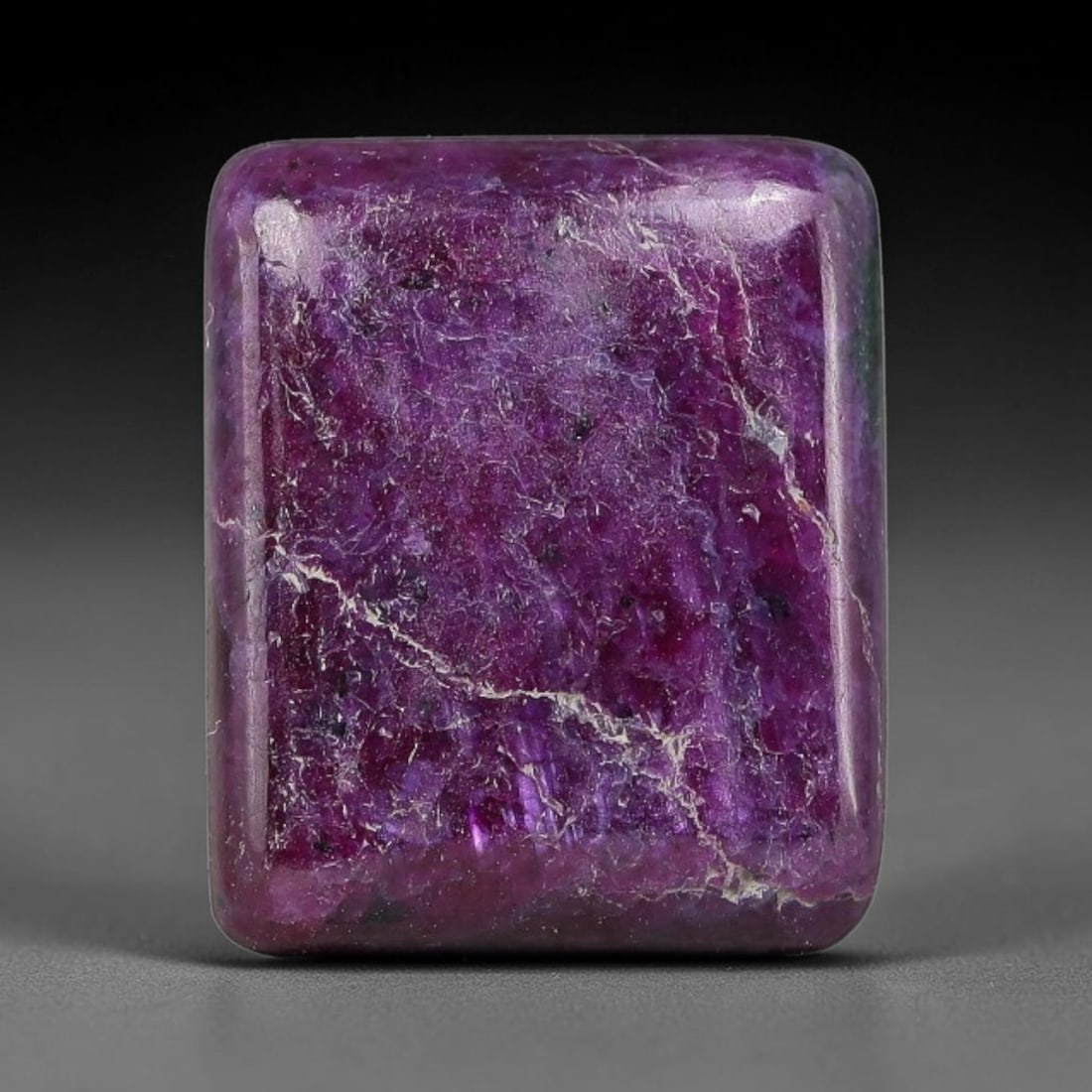 11.57ct Natural Ruby Zoisite Cabochon Loose Gemstone, 87TZ: Natural ruby zoisite cabochon cut, dimensions 14.5x12.2x4.3mm. Rich magenta and deep purple swirling colour pattern with natural mineral veining across the polished surface. Smooth polished cabochon f