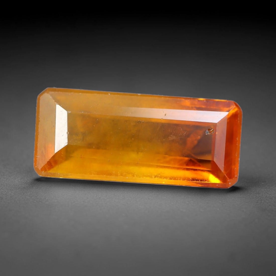 1.77 Carats Natural Yellow Sapphire Octagon Faceted Loose Gemstone, 91TT: This natural yellow sapphire features a classic octagon brilliant faceted cut, holding consistent warm golden-yellow color throughout the corundum crystal. Fine microscopic mineral specks and faint na