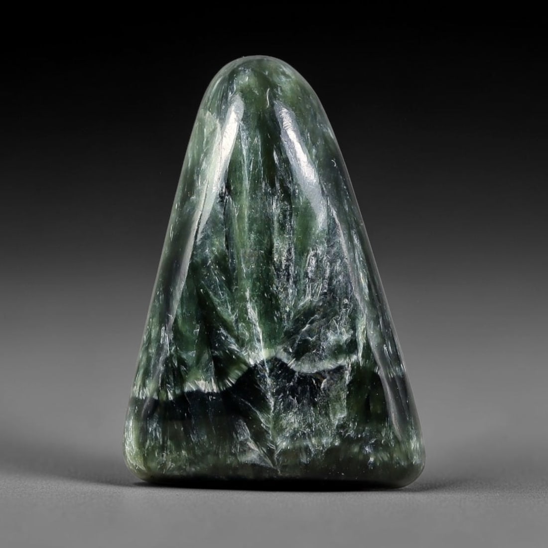 14.42 Carats Natural Deep Green Siberian Seraphinite Polished Cabochon, 70TZ: This is a fully natural polished seraphinite specimen sourced from Siberian deposits, displaying distinct feathery fibrous inclusions that create beautiful flowing chatoyant patterns across its smooth