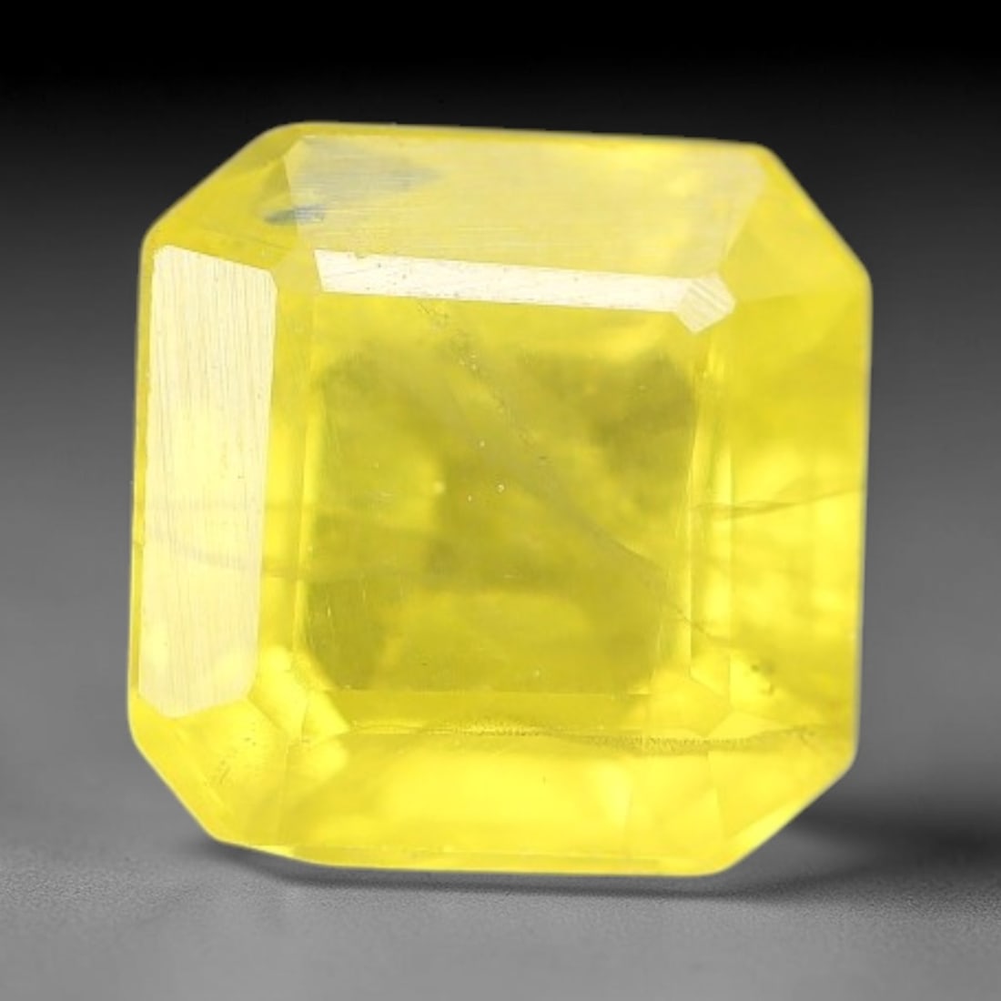 1.66 Carats Natural Yellow Sapphire Square Faceted Loose Gemstone, 56TT: This natural yellow sapphire features a classic square brilliant faceted cut, holding consistent warm golden-yellow color throughout the corundum crystal. Fine microscopic mineral specks and faint nat