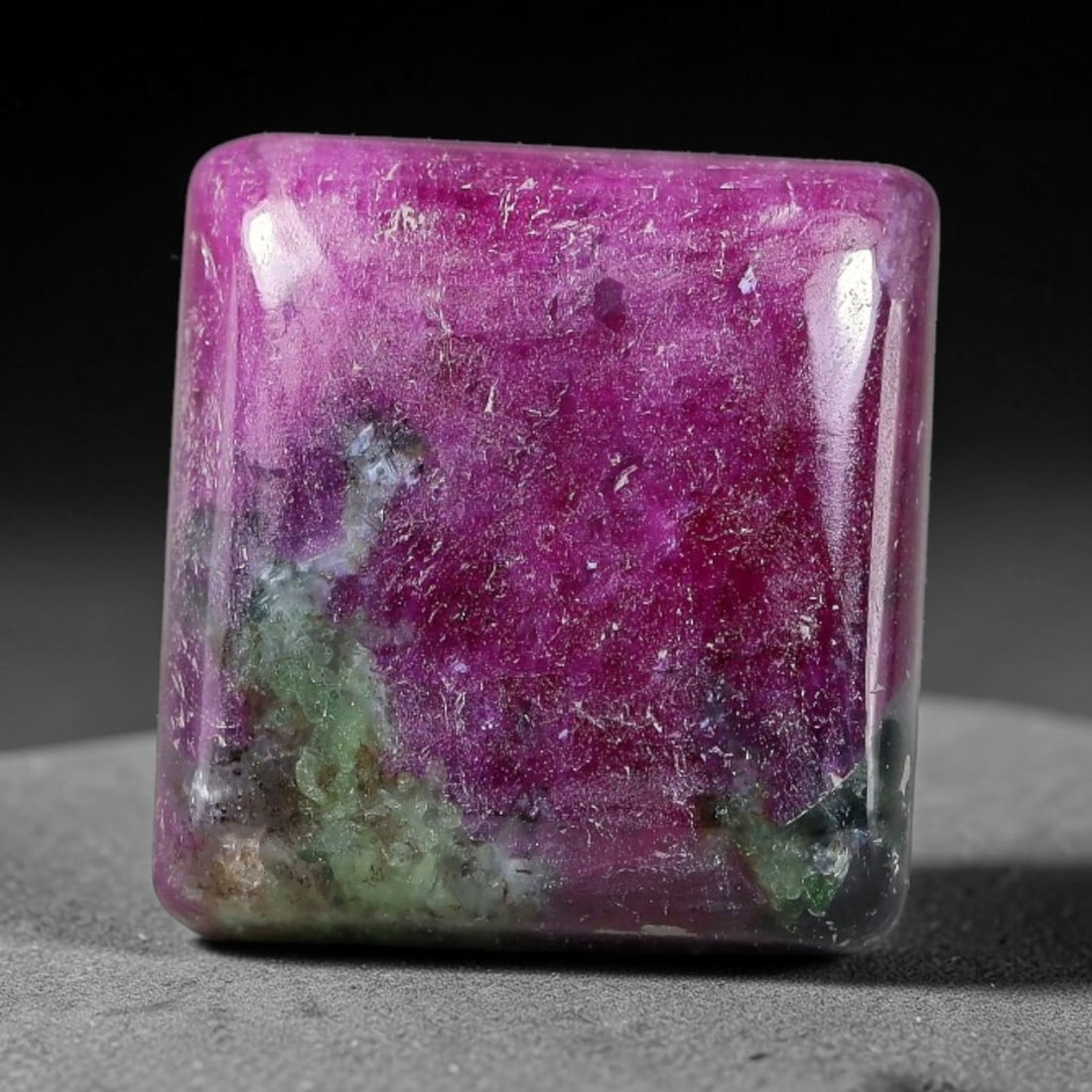 15.90ct Natural Ruby Zoisite Cabochon Loose Gemstone, 96TZ: Natural ruby zoisite cabochon cut, dimensions 14.8x14.0x5.1mm. Rich magenta and deep purple swirling colour pattern with natural mineral veining across the polished surface. Smooth polished cabochon f