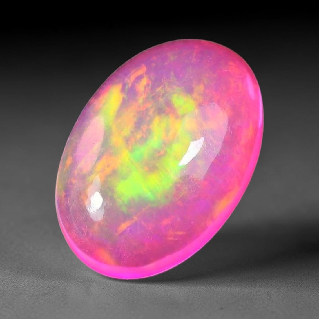 3.35ct Natural Ethiopian Welo Pink Fire Opal Cabochon Loose Gemstone, 97TH: This opal is sourced from Ethiopian Welo natural opal deposits and shaped into a smooth polished cabochon form with refined lapidary finishing work. Bright warm pink base accompanied by vivid internal