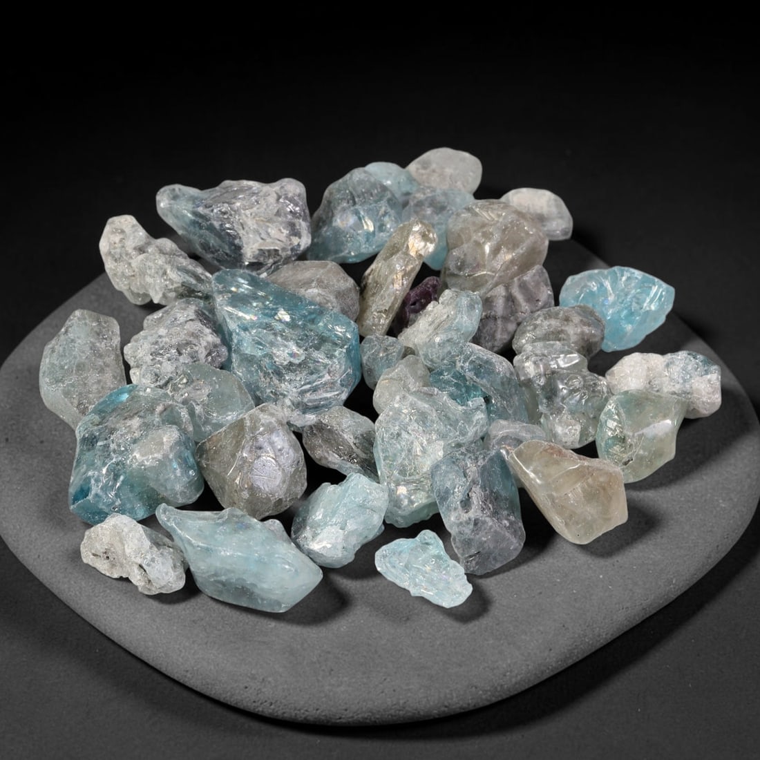 247.47ct Natural Cambodian Blue Zircon Rough Parcel Loose Gemstone, 78YT: This parcel consists of natural unpolished blue zircon rough crystals with translucent sky-blue to teal hues, featuring natural crystalline textures and facets. Minor matrix and inclusions are visible