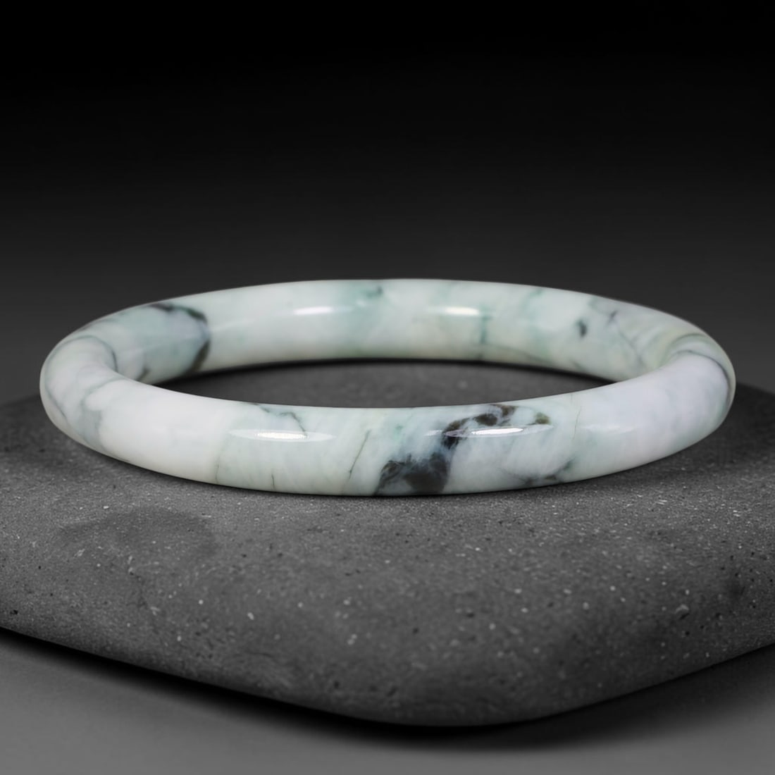 Natural Burmese Type A Variegated Floating Dark Jadeite Jade Slim Bangle Bracelet, 9TJ: Polished slim jadeite bangle with creamy white base accented by flowing variegated teal and dark grey-black floating veining. Inner dimension 57.1x8.8mm, thin rounded band with smooth glossy finish. D