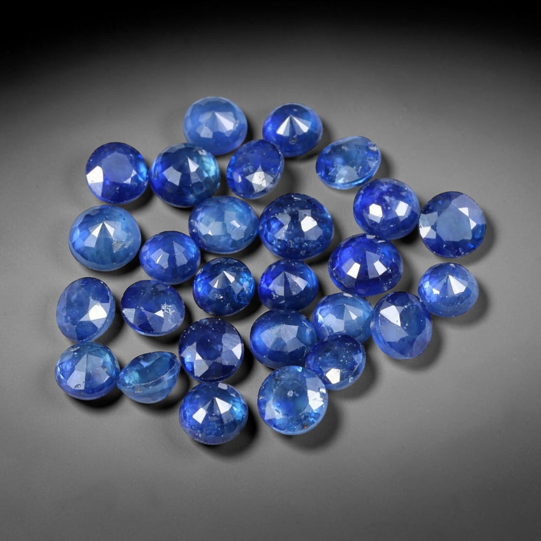 6.19ct Natural Blue Sapphire Round Cut Loose Gemstone 27pcs Parcel, 96YW: This parcel contains twenty-seven round faceted natural blue sapphires with total aggregate weight of 6.19 carats, each stone measuring 3.8x2.6mm. The gemstones show saturated deep blue colouration wi