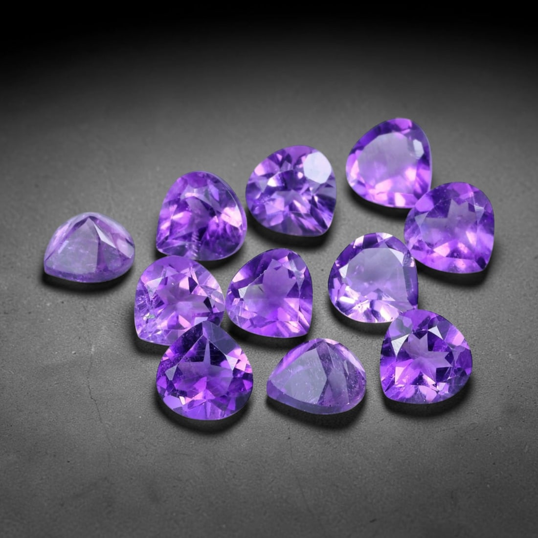 4.80ct Natural Purple Amethyst Trillion Cut Loose Gemstone Parcel, 2TT: This parcel trillion faceted natural amethyst gemstones with aggregate total weight of 4.80 carats, each stone measuring 5.2x5.1x3.5mm. The gems display vibrant rich purple colouration with subtle nat