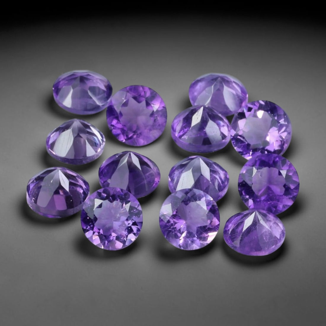3.36ct Natural Purple Amethyst Round Cut Loose Gemstone Parcel, 18TZ: This parcel contains round faceted natural amethyst gemstones with aggregate total weight of 3.36 carats, each stone measuring 4.1x3.1mm. The gems display rich purple colouration with subtle natural i