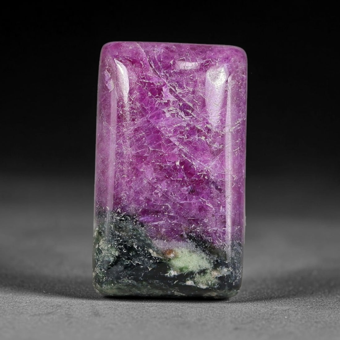 15.78ct Natural Ruby Zoisite Cabochon Loose Gemstone, 3TY: Natural ruby zoisite cabochon cut, dimensions 19.0x11.1x5.1mm. Rich magenta and deep purple swirling colour pattern with natural mineral veining across the polished surface. Smooth polished cabochon f