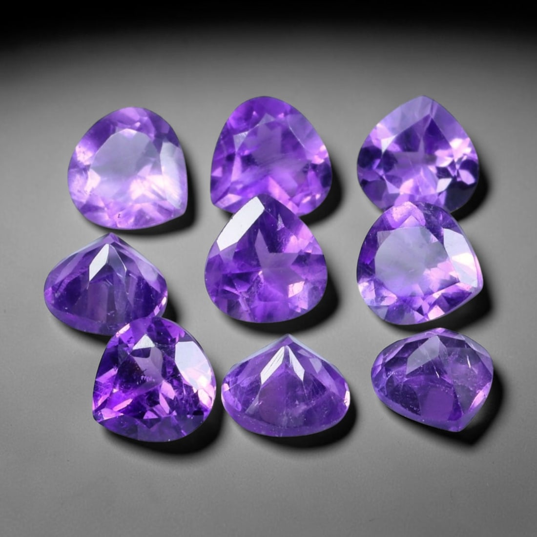 4.06ct Natural Purple Amethyst Trillion Cut Loose Gemstone Parcel, 5TT: This parcel trillion faceted natural amethyst gemstones with aggregate total weight of 4.06 carats, each stone measuring 5.2x3.3mm. The gems exhibit vivid saturated purple colouration with subtle natu