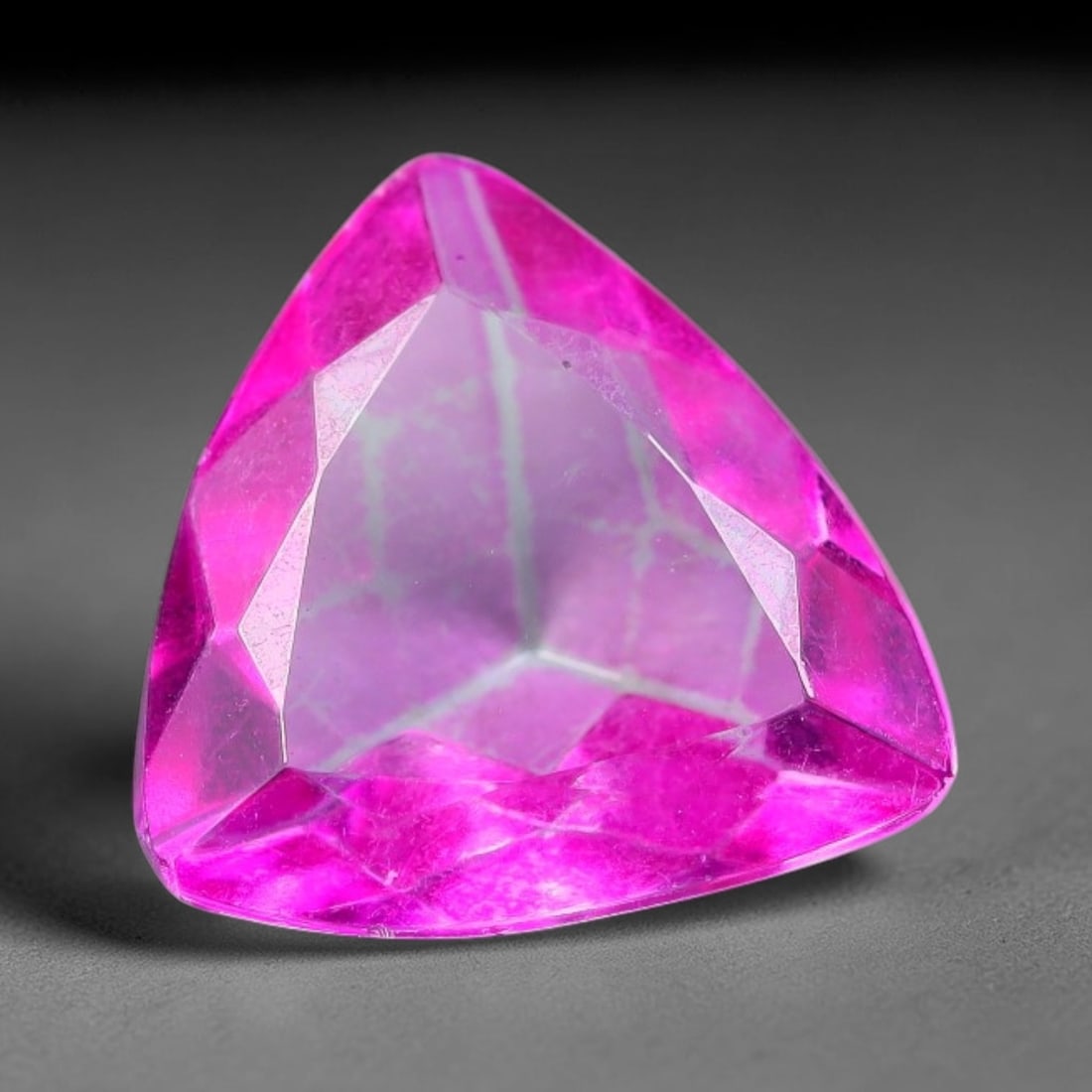2.55 Carats Natural Brazilian Pink Topaz Trillion Faceted Loose Gemstone, 5TM: This specimen is composed of natural topaz sourced from Brazilian mineral deposits, processed via professional faceted lapidary techniques with consistent glossy polishing applied to the entire crysta