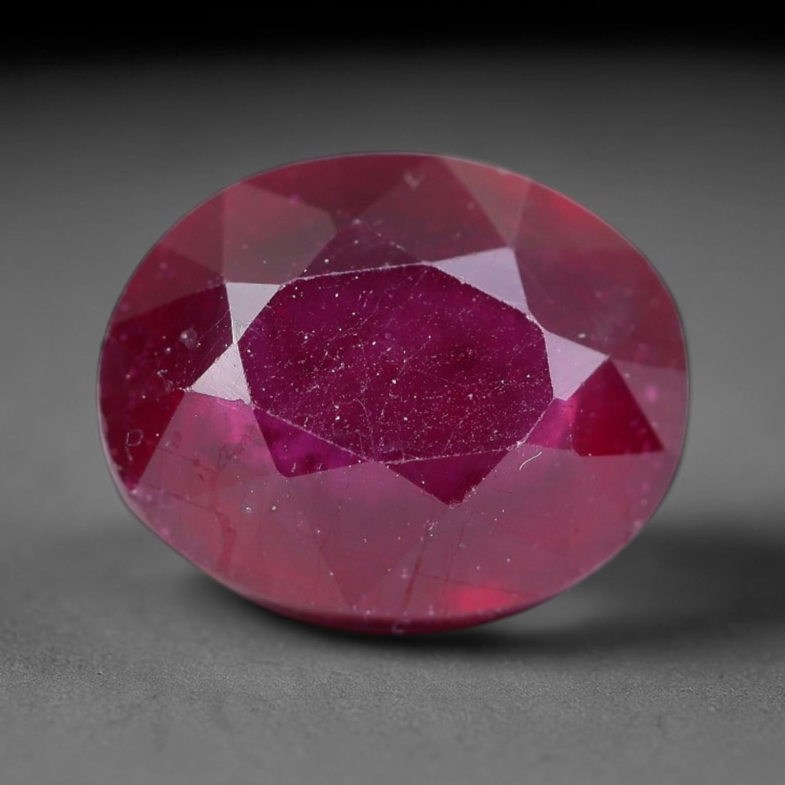 5.42 Carats Natural Madagascar Ruby Oval Faceted Loose Gemstone, 97TY: This sizable natural Madagascar ruby is cut into an oval brilliant faceted form, showcasing rich saturated crimson red hue characteristic of Malagasy corundum. Extensive natural internal silk veining,