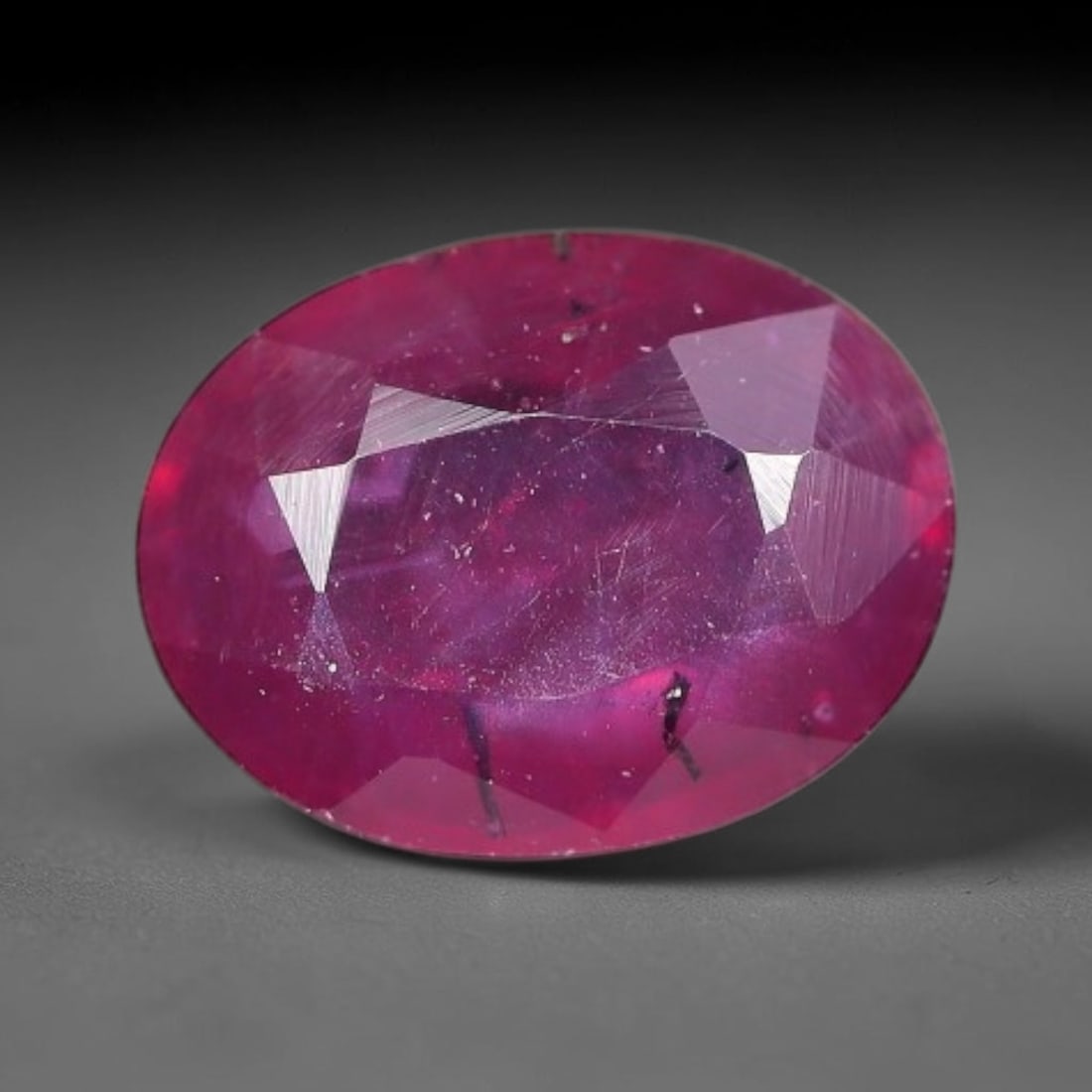 1.92 Carats Natural Mozambique Ruby Oval Faceted Loose Gemstone, 74TY: This natural Mozambique ruby is fashioned with standard oval brilliant faceting, displaying vivid saturated crimson-red hue accompanied by native fine mineral inclusions and subtle trace marks inheren