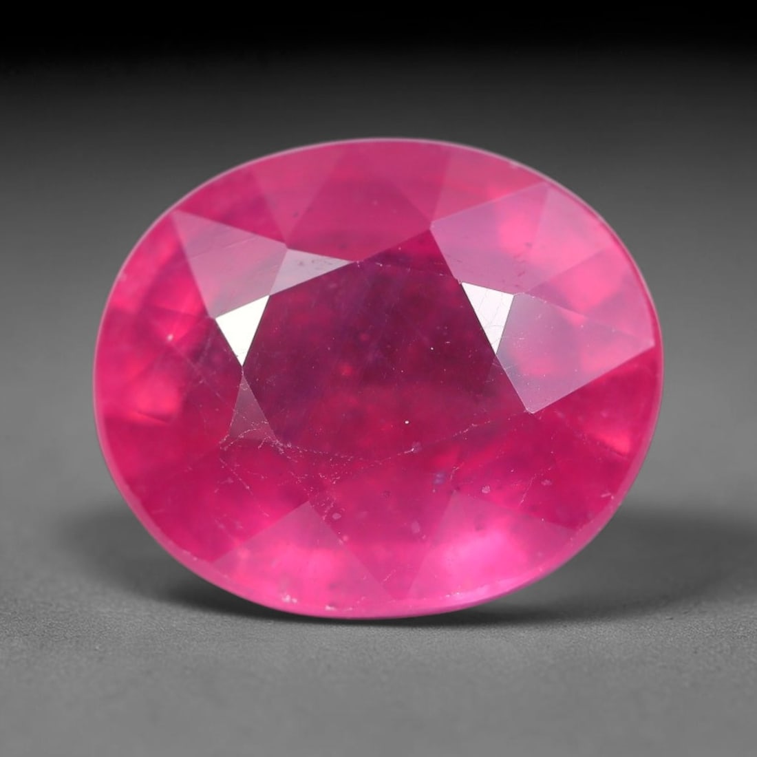 6.46 Carats Natural Mozambique Ruby Oval Faceted Loose Gemstone, 15SA: This natural Mozambique ruby is fashioned with standard oval brilliant faceting, displaying vivid saturated crimson-red hue accompanied by native fine mineral inclusions and subtle trace marks inheren