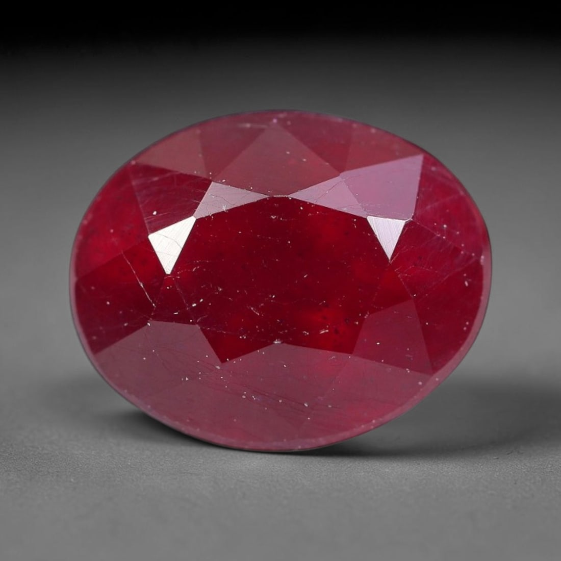 3.84 Carats Natural Madagascar Ruby Oval Faceted Loose Gemstone, 98TY: This sizable natural Madagascar ruby is cut into an oval brilliant faceted form, showcasing rich saturated crimson red hue characteristic of Malagasy corundum. Extensive natural internal silk veining,
