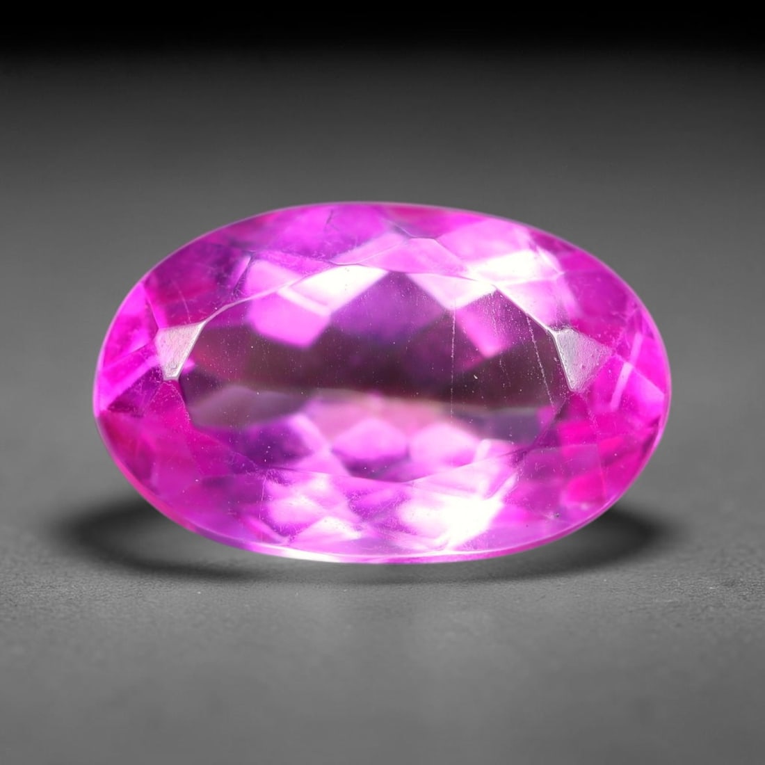 5.46 Carats Natural Brazilian Pink Topaz Oval Faceted Loose Gemstone, 88SA: This specimen is composed of natural topaz sourced from Brazilian mineral deposits, processed via professional faceted lapidary techniques with consistent glossy polishing applied to the entire crysta