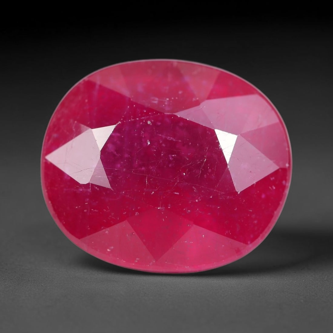 10.26 Carats Natural Mozambique Ruby Oval Faceted Loose Gemstone, 13SA: This natural Mozambique ruby is fashioned with standard oval brilliant faceting, displaying vivid saturated crimson-red hue accompanied by native fine mineral inclusions and subtle trace marks inheren
