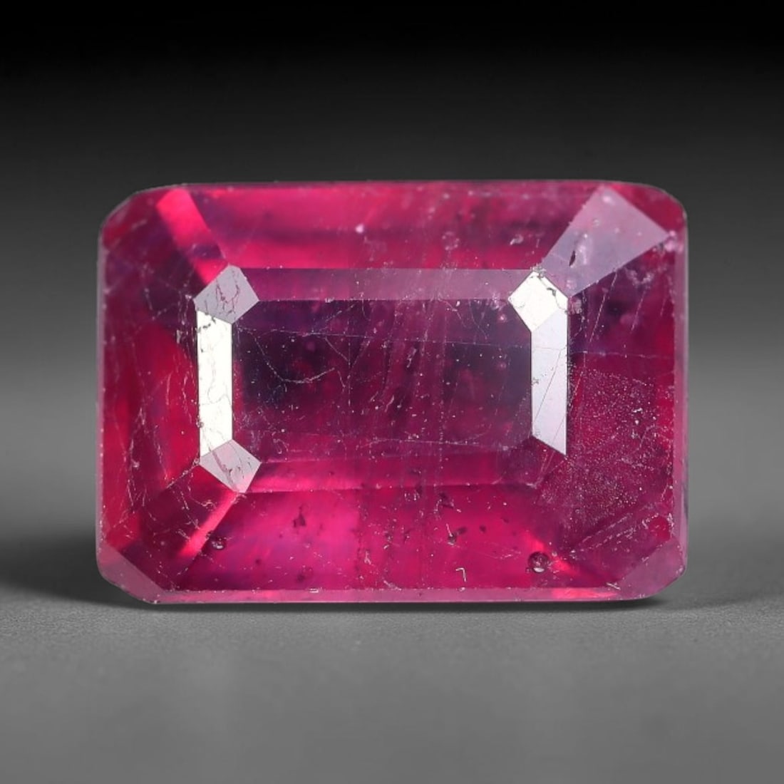 4.93 Carats Natural Mozambique Ruby Octagon Faceted Loose Gemstone, 80TY: This natural Mozambique ruby is fashioned with standard octagon brilliant faceting, displaying vivid saturated crimson-red hue accompanied by native fine mineral inclusions and subtle trace marks inhe