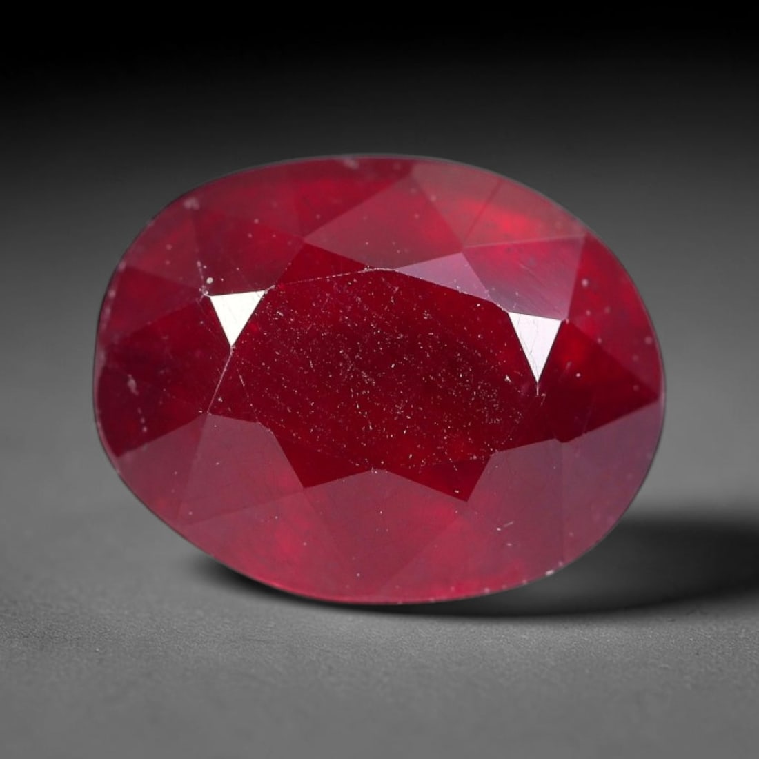 4.17 Carats Natural Madagascar Ruby Oval Faceted Loose Gemstone, 6SA: This sizable natural Madagascar ruby is cut into an oval brilliant faceted form, showcasing rich saturated crimson red hue characteristic of Malagasy corundum. Extensive natural internal silk veining,