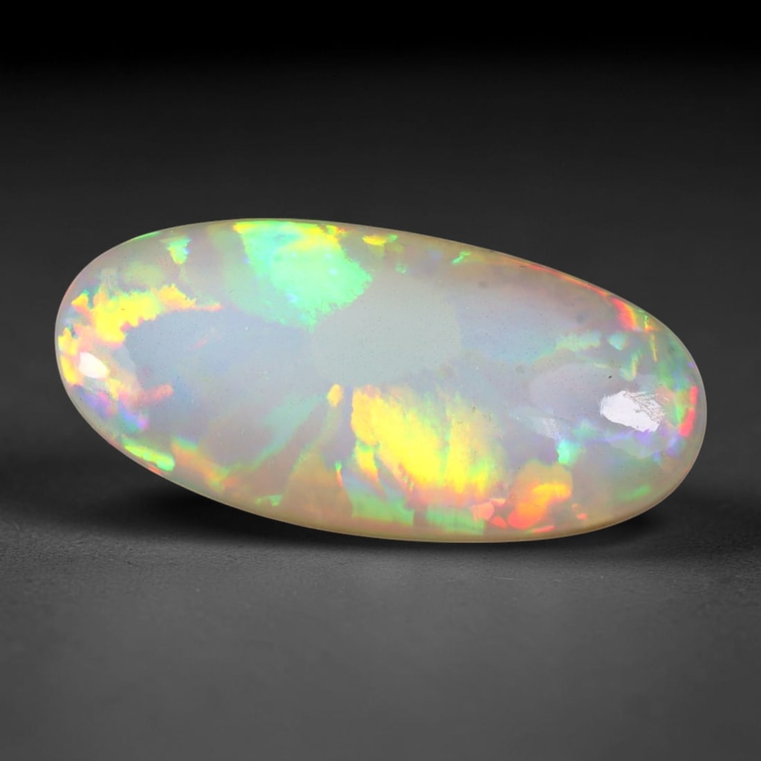 10.26ct Natural Multicolor Fire Ethiopian Welo Solid Opal Cabochon, 55TY: Formed from natural silica deposits within Ethiopian mineral veins, this solid opal cabochon features a smooth polished domed surface that highlights its natural light diffraction properties. Distinct