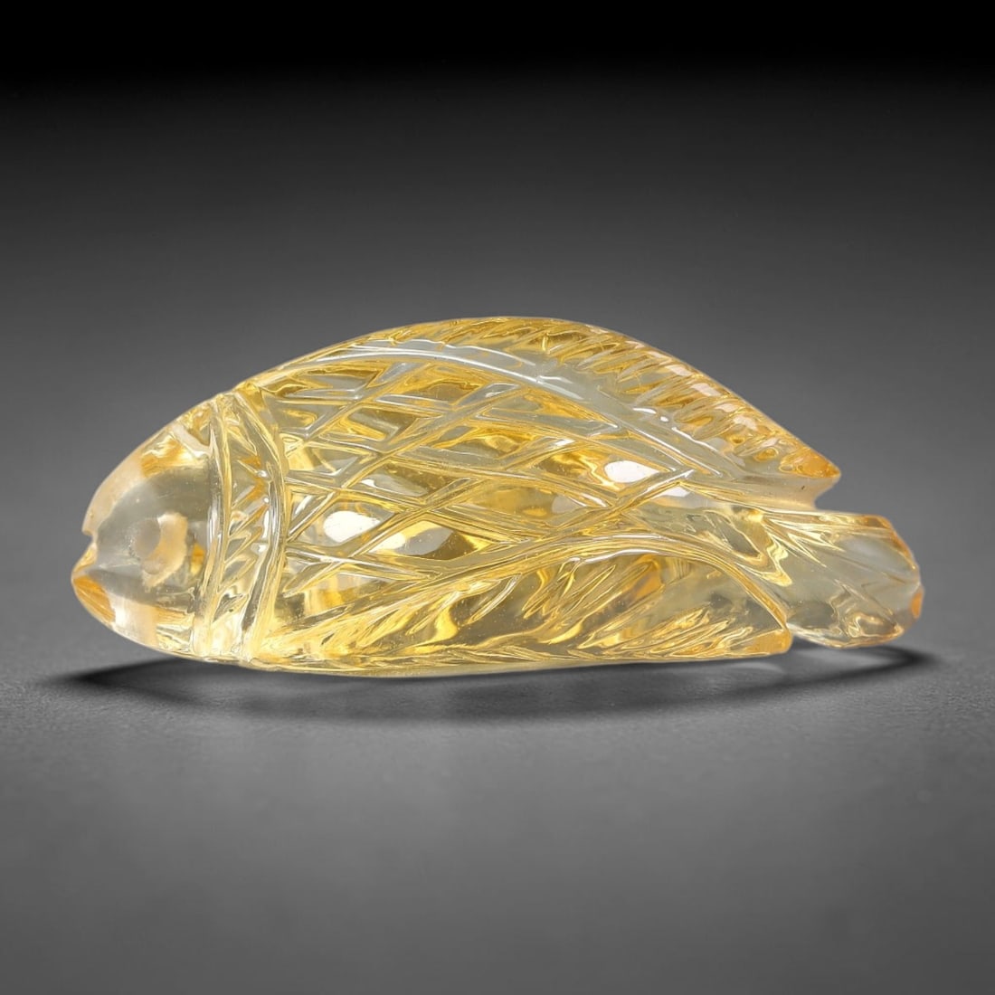25.90ct Natural Citrine Fish Carved Loose Gemstone, 54TY: Natural citrine hand carved fish loose gemstone, measuring 33.6x13.8x10.7mm. Bright golden yellow tone with fine detailed polished carving. Perfect for one-of-a-kind pendant creation, gem display and 