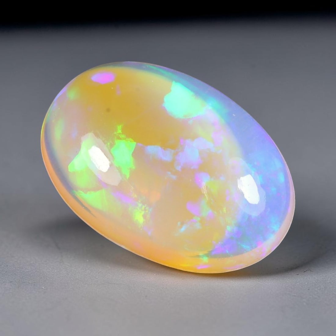 14.29ct Natural Multicolor Fire Ethiopian Welo Solid Opal Cabochon, 60TY: Formed from natural silica deposits within Ethiopian mineral veins, this solid opal cabochon features a smooth polished domed surface that highlights its natural light diffraction properties. Distinct